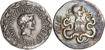 a silver coin with an image of a woman on it