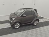 an image of a smart car parked in a garage