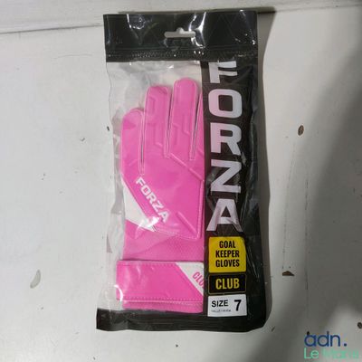 a pink glove that is in a bag on a table