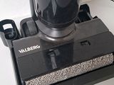 a close up of a vacuum cleaner on a white surface