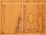 an old wooden door with peeling paint on the outside of it