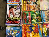 a lot of comic books that are on the floor