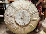 a woman that is standing next to a large object