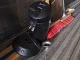 an image of a broom and brush on the side of a train