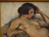 a painting of a nude woman laying on a bed
