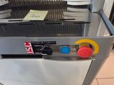 a machine that is sitting on the floor in the kitchen