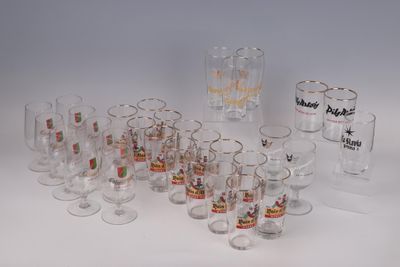 a lot of glasses that are sitting on a table