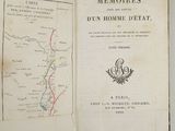 an open book with a map on it on a table