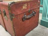two old suitcases sitting on the floor next to each other