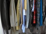 a closet with a lot of clothes and shoes on it