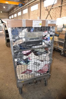 a metal cage with a bunch of items inside of it