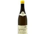 a bottle of wine that is sitting on a table