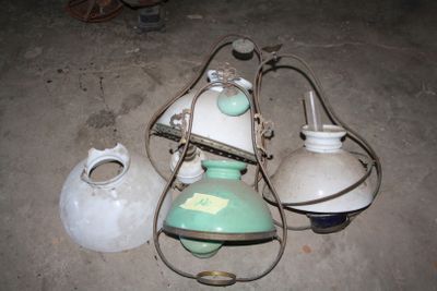 three lamps that are sitting on the ground next to each other