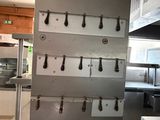 a picture of a commercial kitchen with a lot of counter space