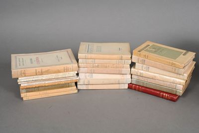 several books stacked on top of each other on a table