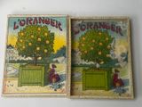 two books with oranges on them sitting on a table