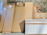 a lot of boxes and a tv in a room