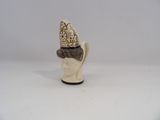 a figurine of a head with a crown on top of it