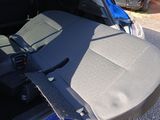 a seat in the back of a car with a seat belt