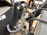 an image of a close up of a backhoe of a construction vehicle