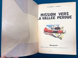 someone is holding a book with a picture of a plane in it