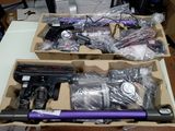 two boxes that have guns in them on a table
