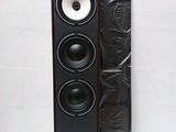 a close up of a pair of speakers sitting on top of a table