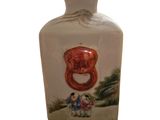 a white vase with a picture of a man and a woman on it