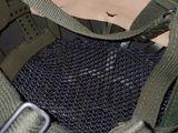 a close up of a military helmet with a metal buckle