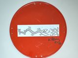 a red sign with a drawing of a fish on it