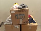 a pile of boxes sitting on a pallet in a room
