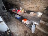 an image of a kitchen with a table and a stove