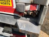a close up of a truck ' s bumper with a sign on it