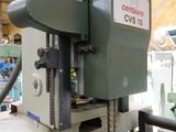 a machine that is working on a piece of wood