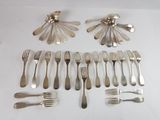 many forks and spoons laid out on the table
