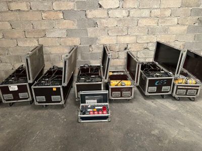 many different types of cases lined up against a brick wall
