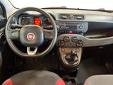 the interior of a small car with a steering wheel and dashboard