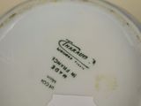 a close up of a plate with a tag on it
