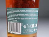 a close up of a bottle of honey on a table