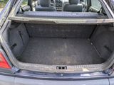 a trunk of a car with the back seats folded down