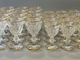 a lot of glasses that are sitting on a table