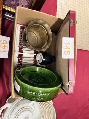 many plates and bowls in a box on the table