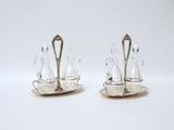 a pair of silver plated salt and pepper shakers