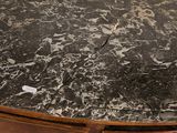 a marble top table with a wooden base