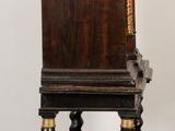 a wooden chair that is sitting on a wooden floor