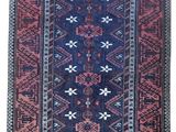 a blue and red rug on a white background