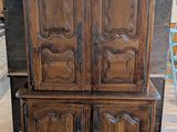 an image of a wooden cabinet sitting on top of a hard wood floor