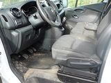 a white truck with the door open sitting in a parking lot
