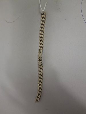 a close up of a metal chain with a chain attached to it
