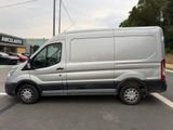 a silver van that is parked in a parking lot
